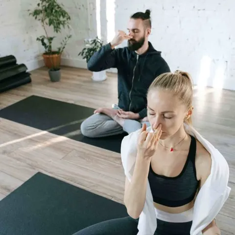 Vision board photo of a couple doing yoga — a health and wellness goal